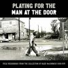 Playing_for_the_man_at_the_door